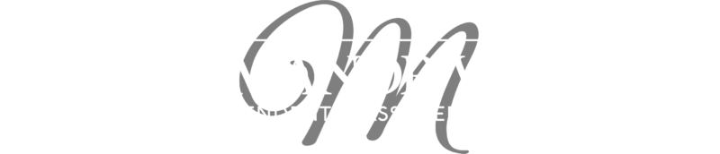 A rectangular logo with a black background and white border, containing the words 